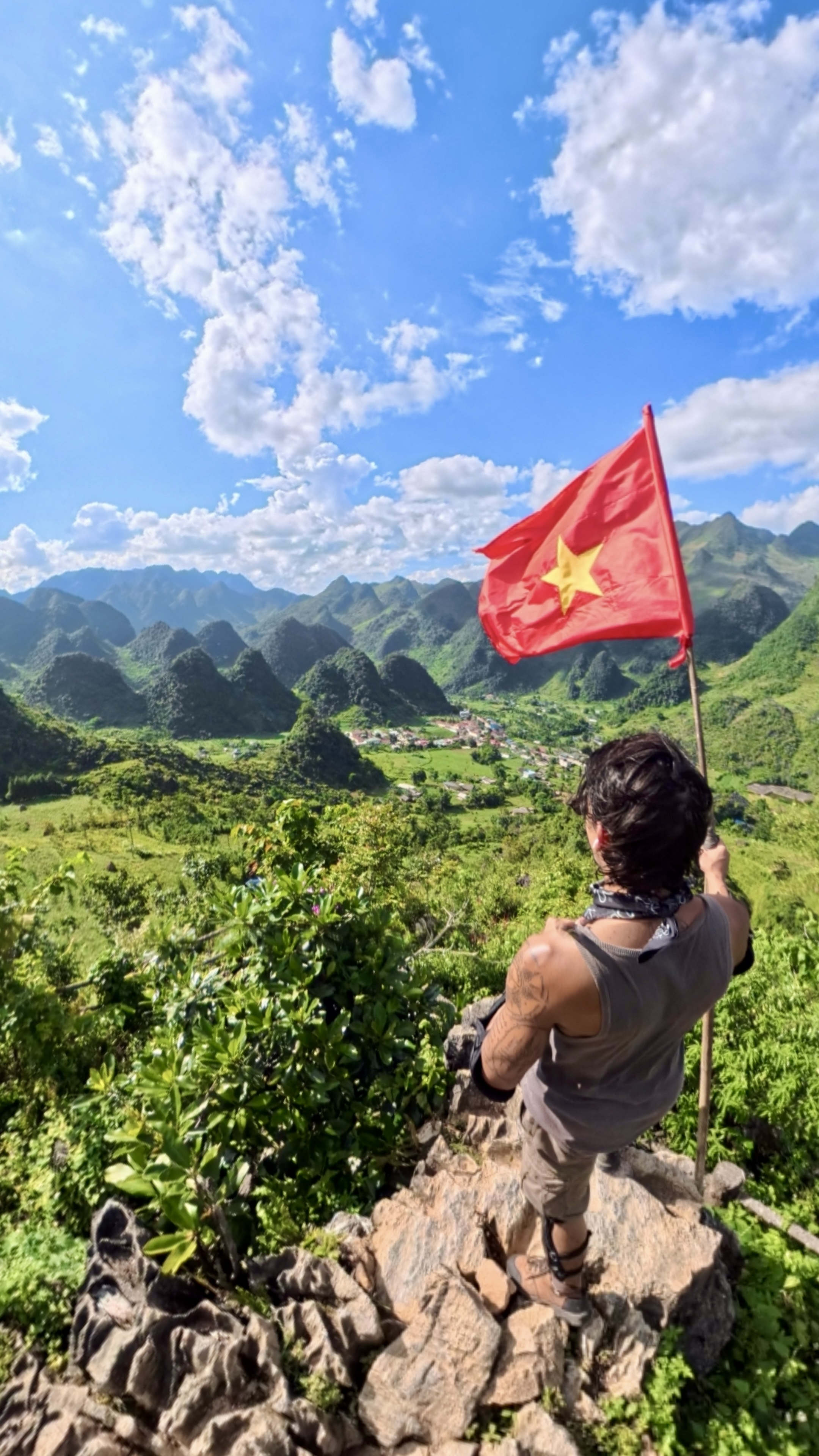 Ken with flag in Vietnam